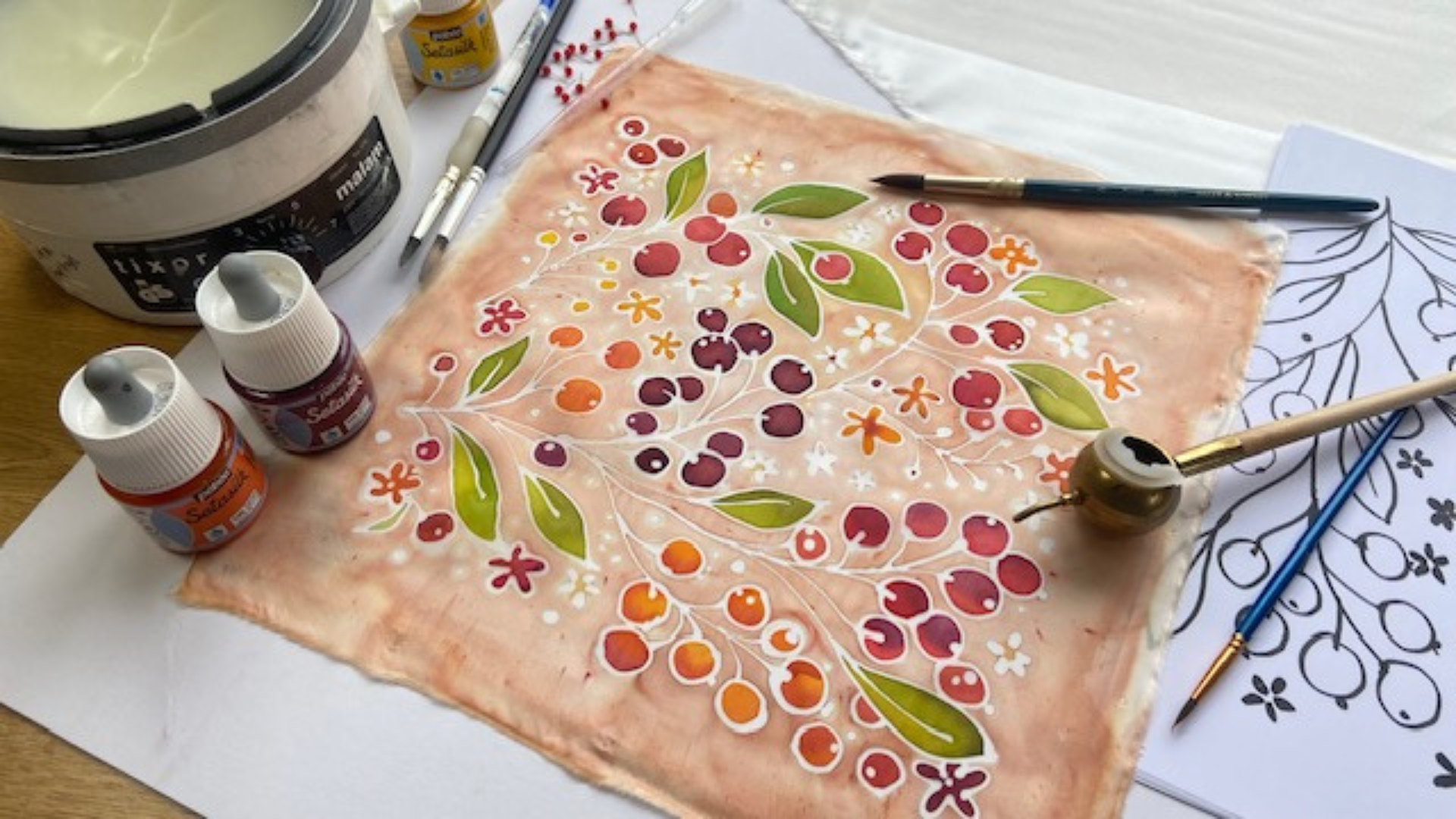 A batik print showing autumn berries